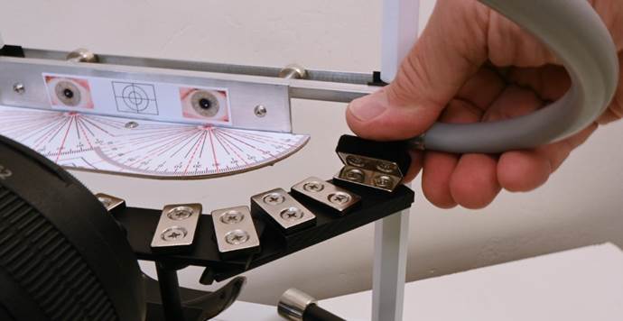 A hand holding a tool
Description automatically generated