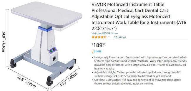 A medical work table with wheels
Description automatically generated