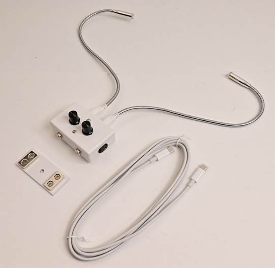A white device with a cable
Description automatically generated
