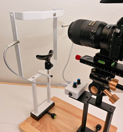 A camera on a stand
Description automatically generated