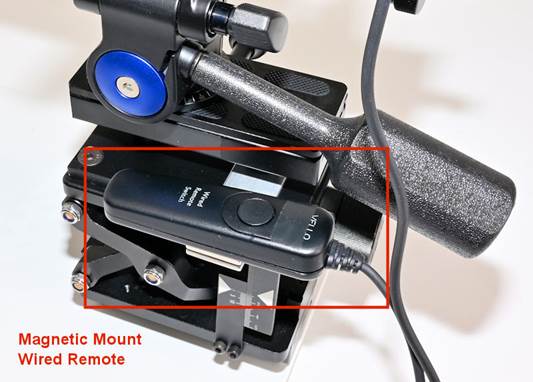 A remote control for a camera
Description automatically generated